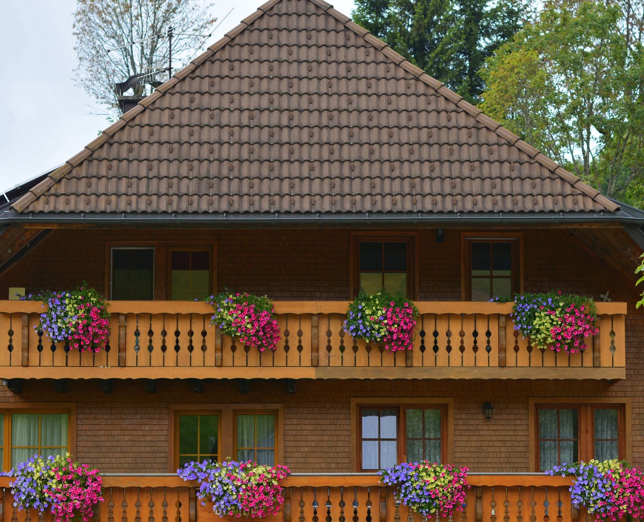 farmhouse forest house balcony with flowers free photo