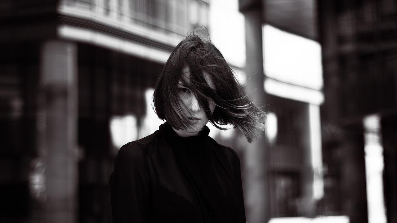 fashionable girl in glasses in the black free photo