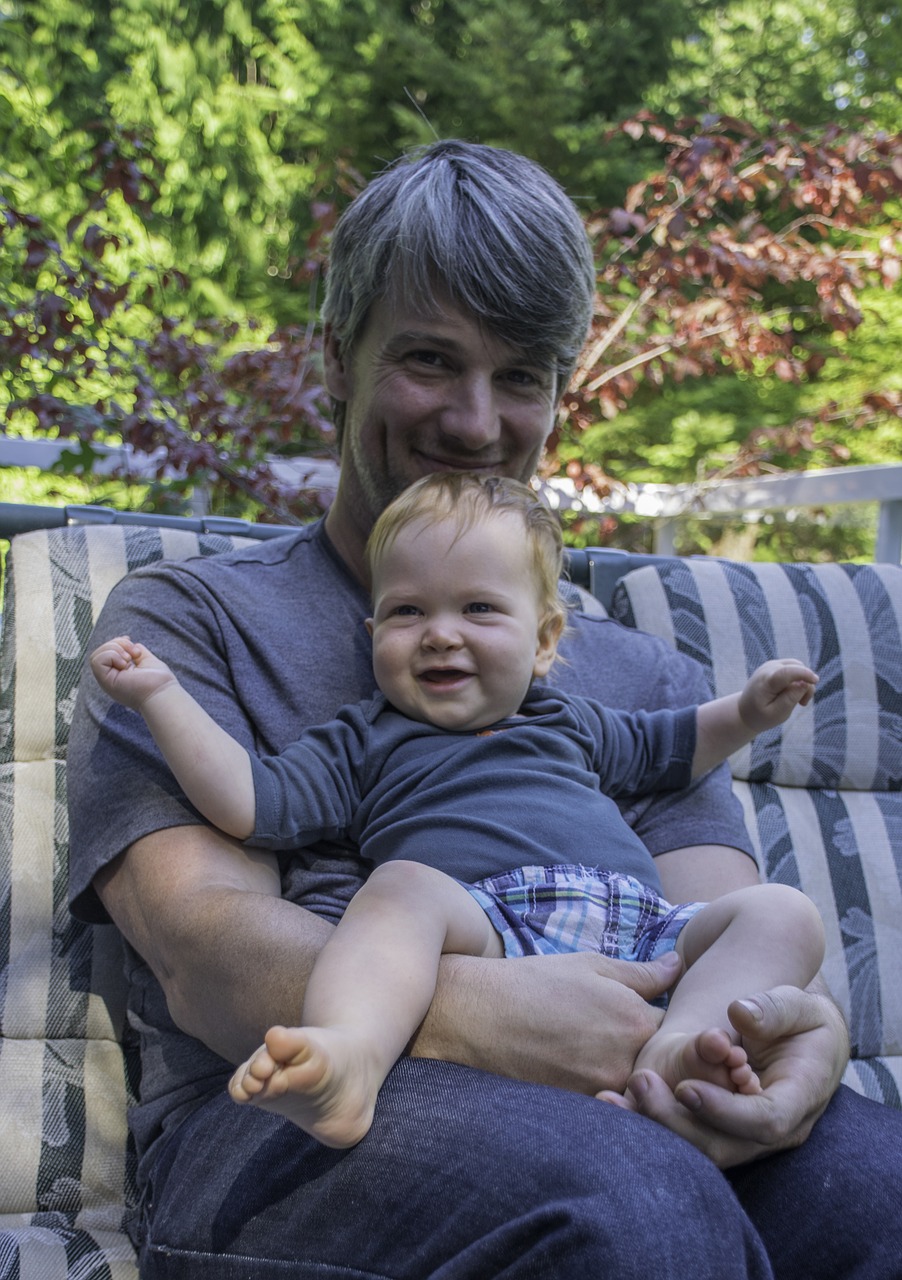 father son smiling free photo