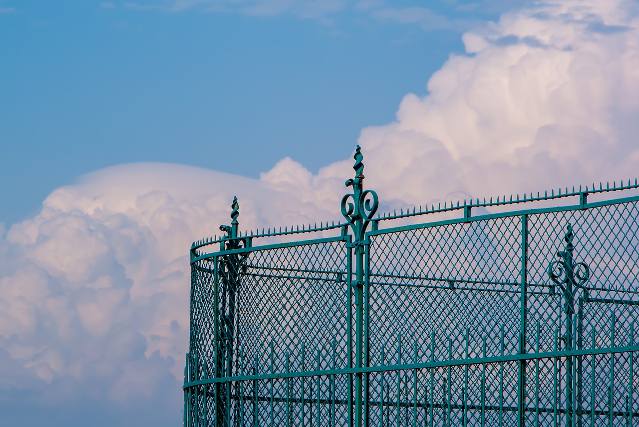 fence  clouds  sky free photo