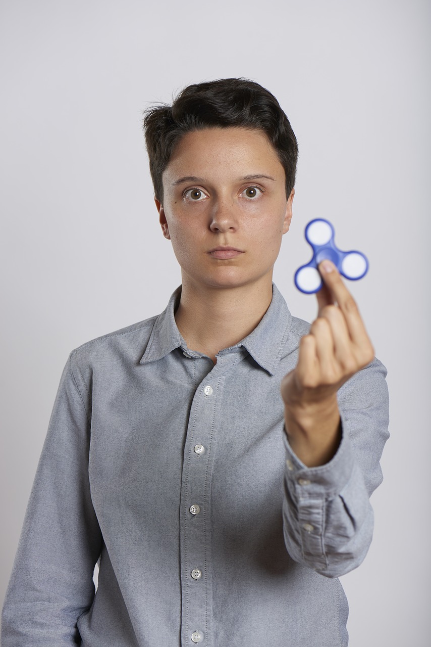 fidget spinner woman holding free photo