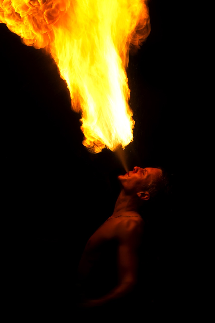 fire breathing person free photo