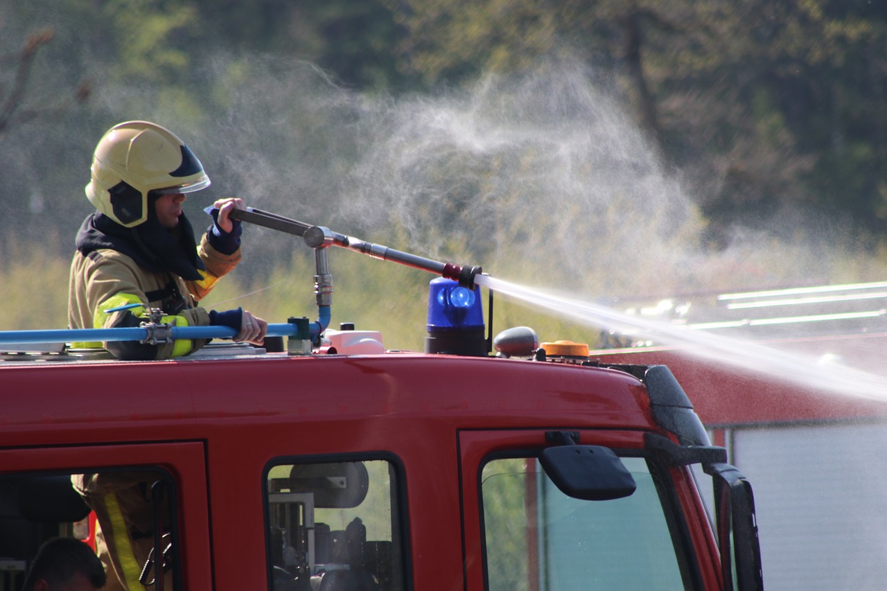 fire department  extinguishing  heath fire free photo