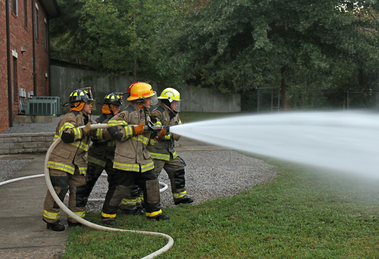 fire fighters hose training firefighter free photo