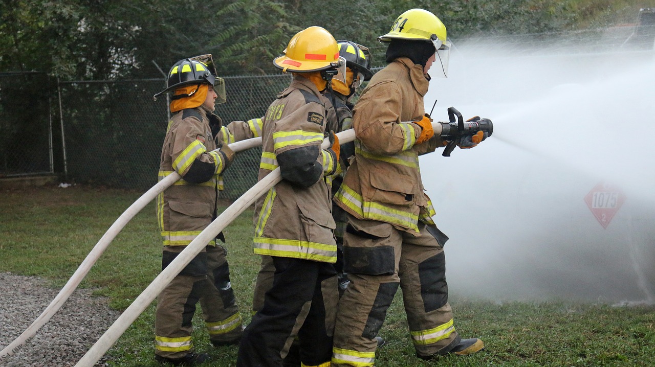 fire fighters hose training firefighter free photo