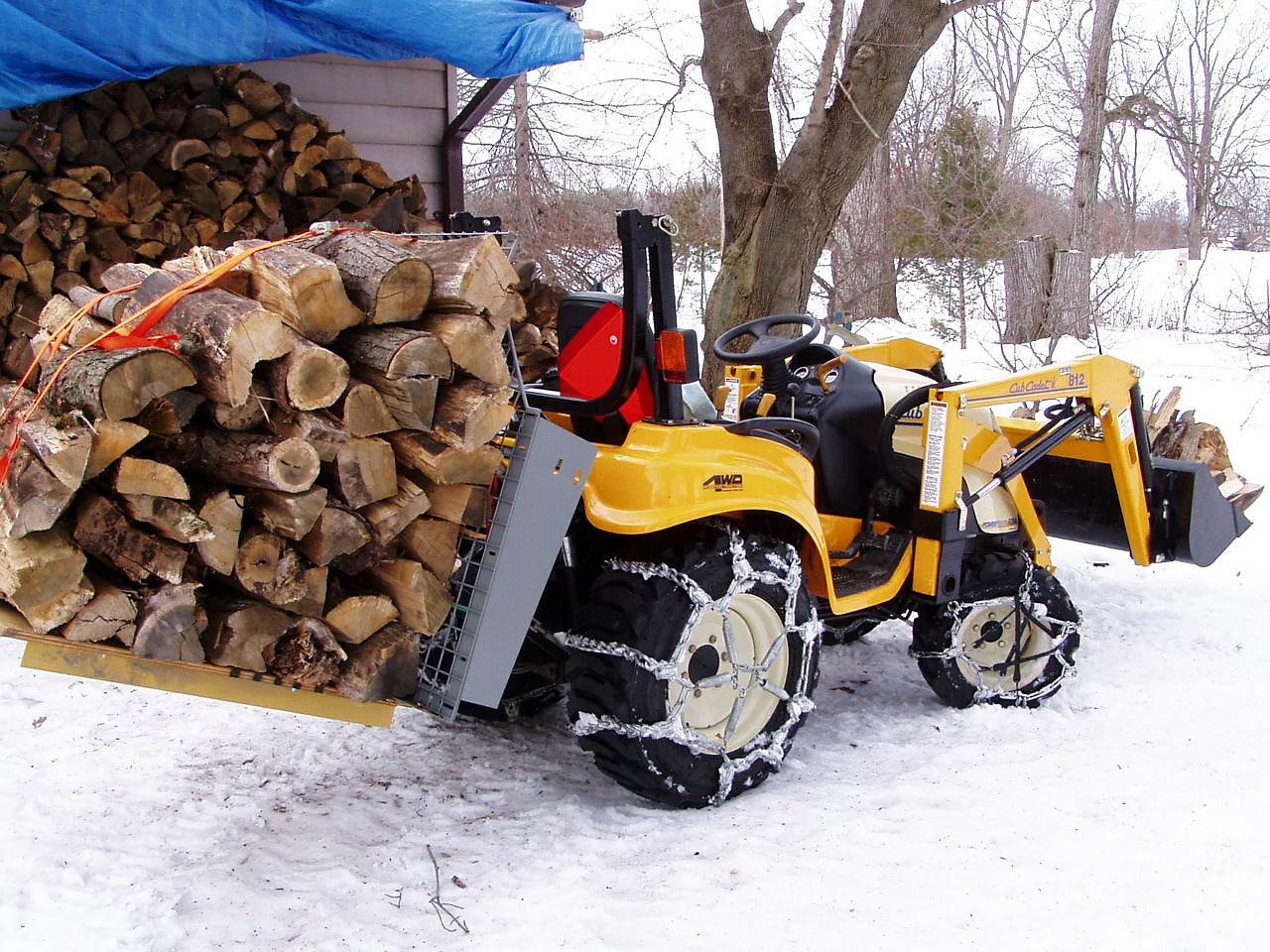 firewood tractor hauling wood free photo