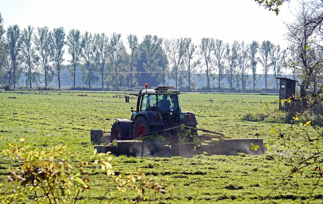 first cut  meadow  tractor free photo