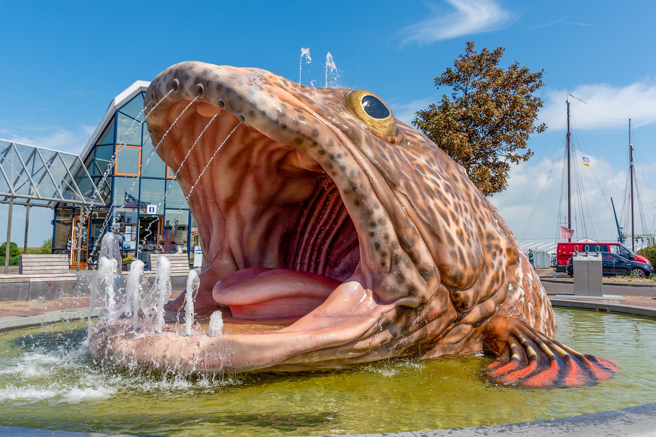 fish  statue  water free photo