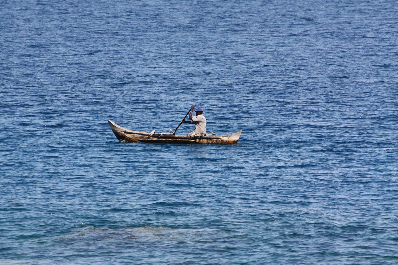 fisherman sea canoe free photo