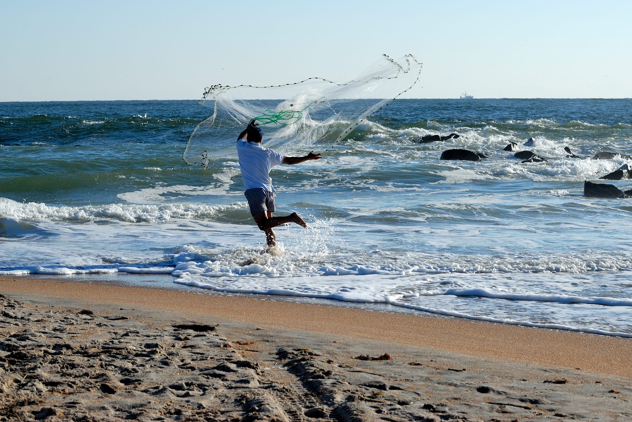 fisherman casting net bait free photo