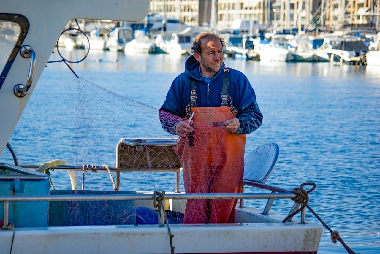 fisherman boat fish net free photo