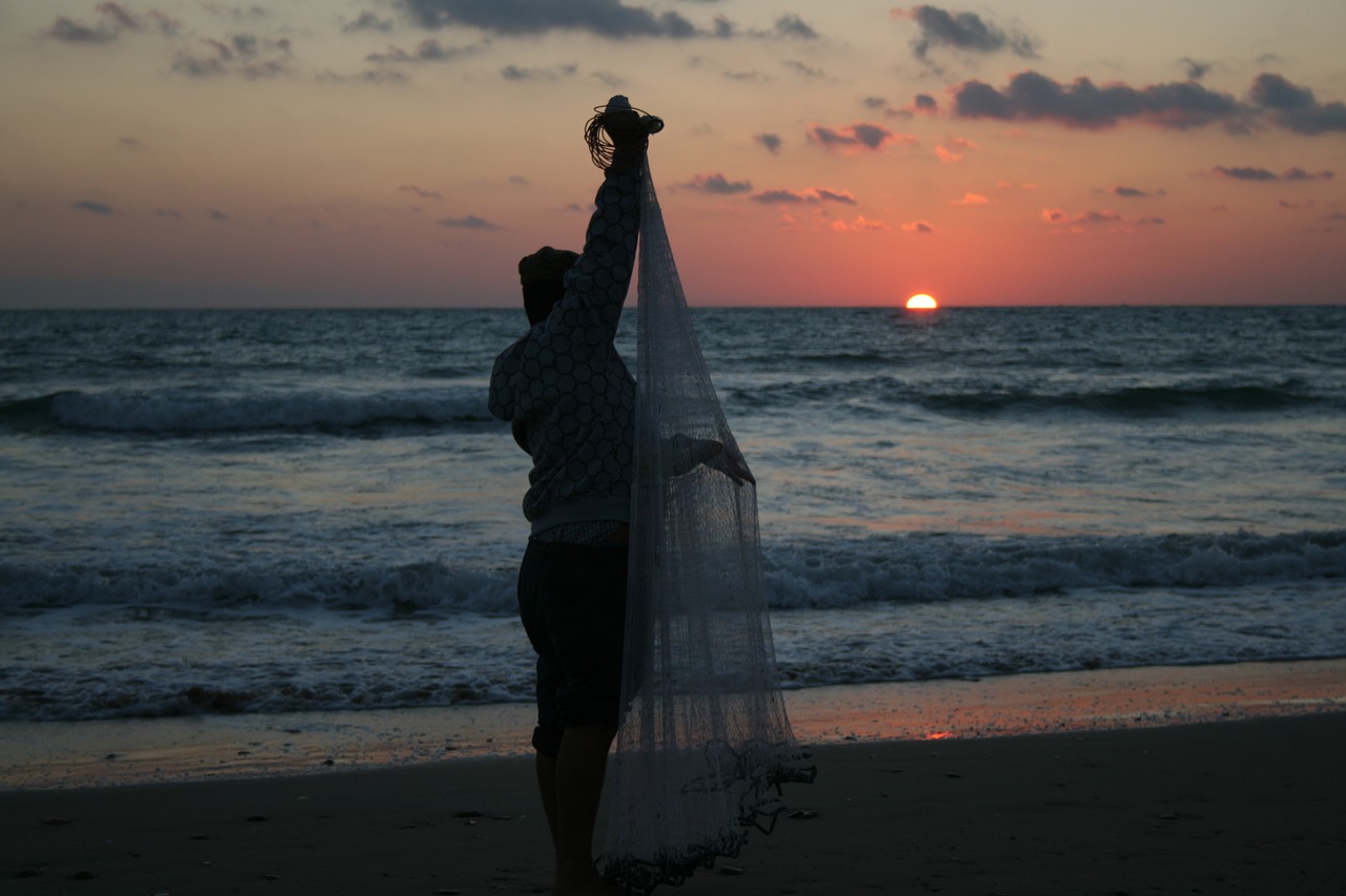 fisherman sunset sea free photo