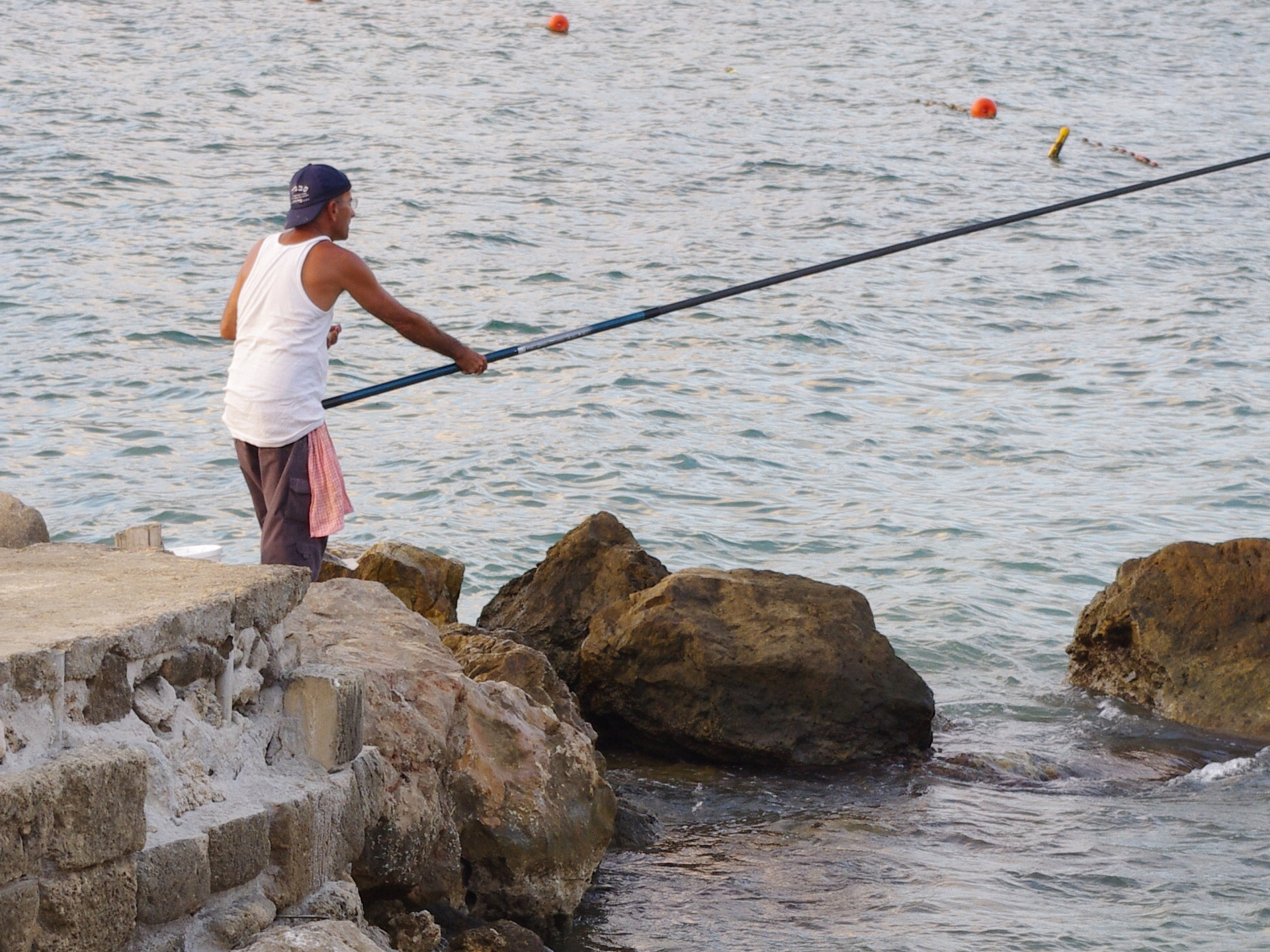 fisherman rocks sea free photo