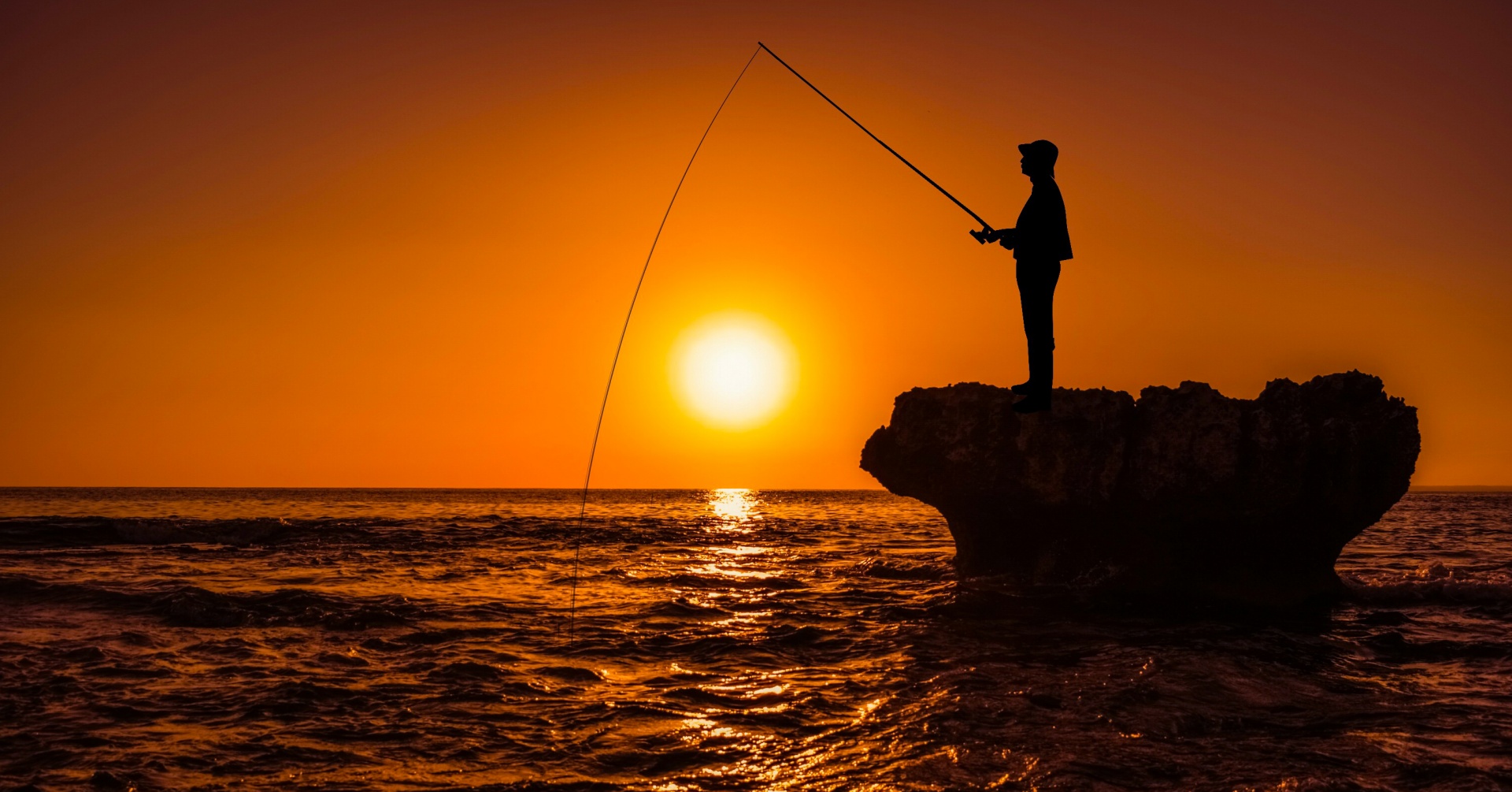 Fly Fisherman Stands In The Water And Casts The Fly With Fishing