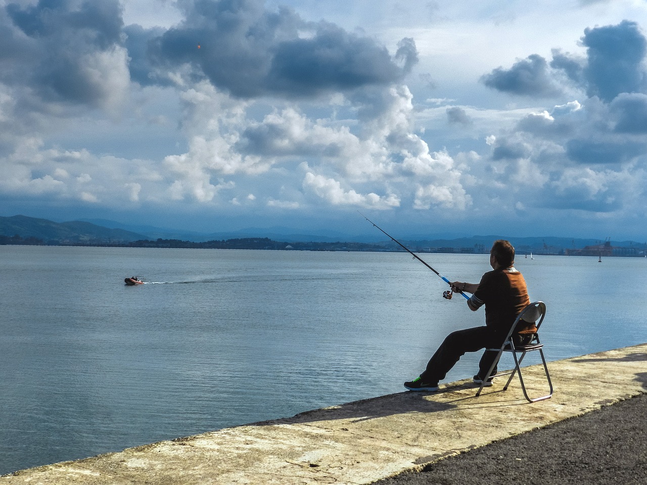 fishing sea mountain free photo