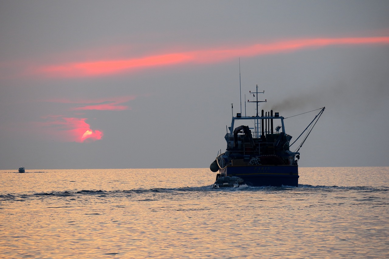 fishing boat  boat  sunset free photo