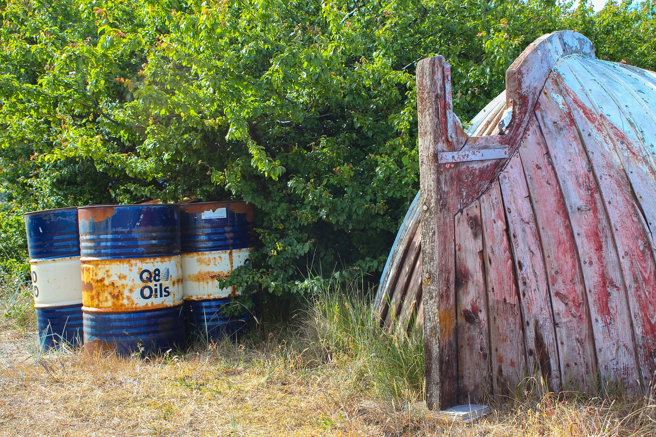 fishing boat  wreck  oil barrel free photo