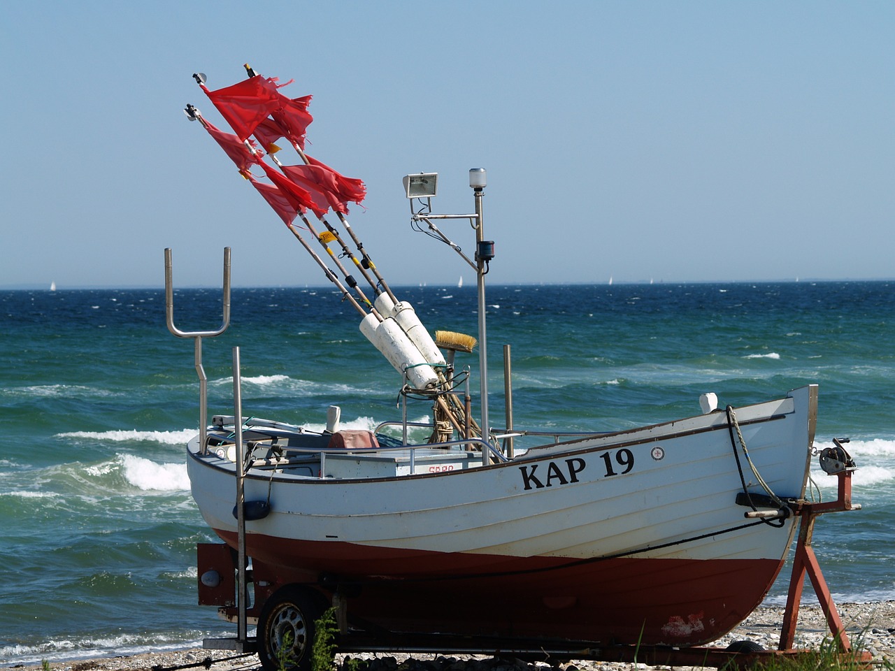 fishing boat beach buoys free photo