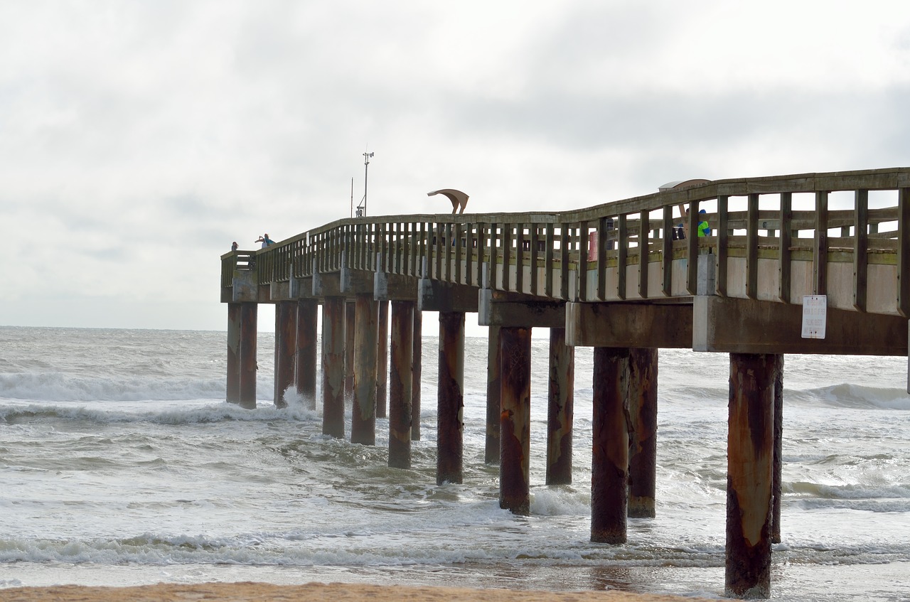 fishing pier structure cloudy day free photo