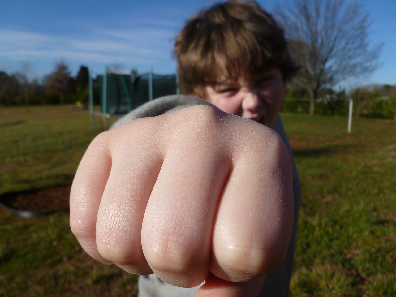 fist bump boy outside free photo