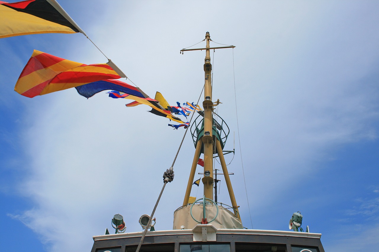 flags on tugboat boat tug free photo