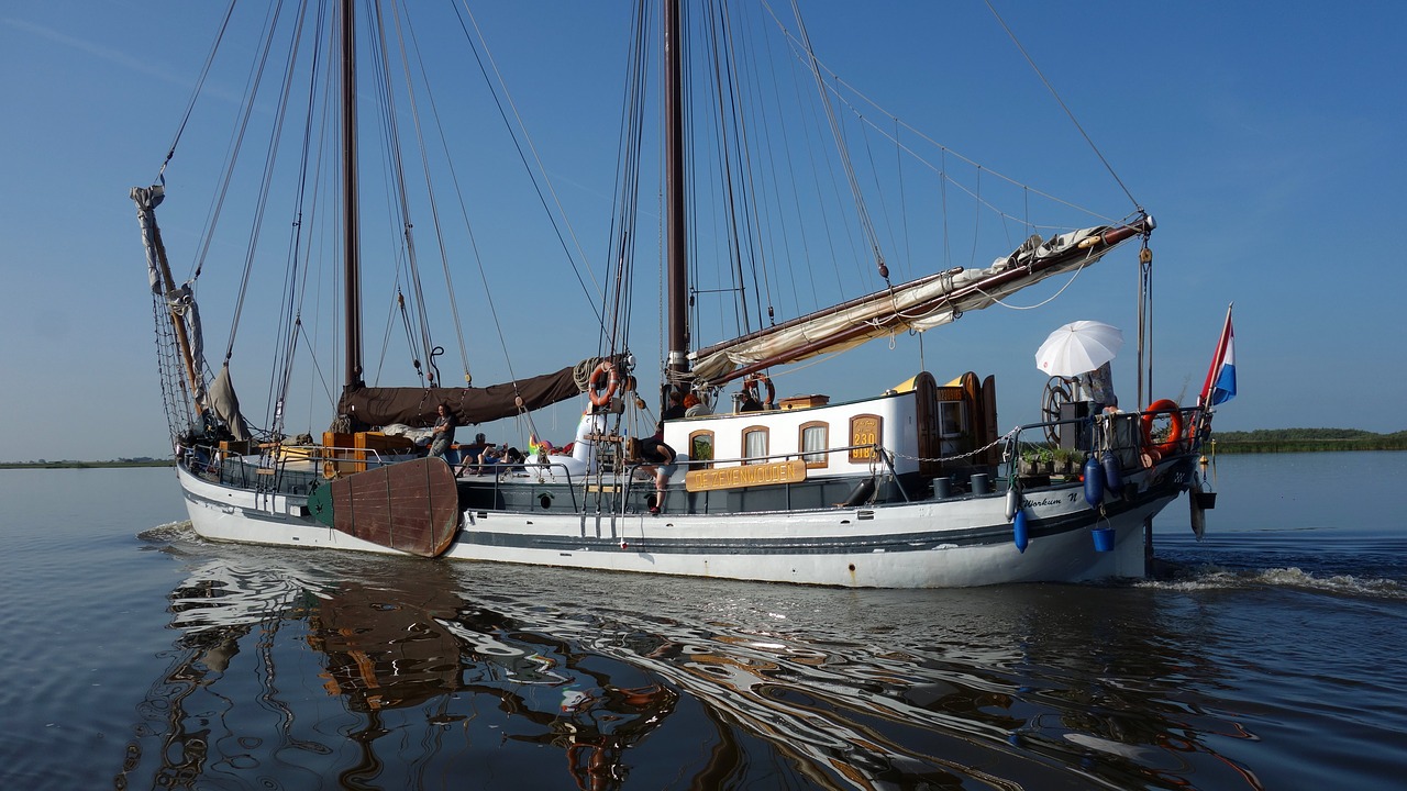 flat bottom boat sailing ship free photo