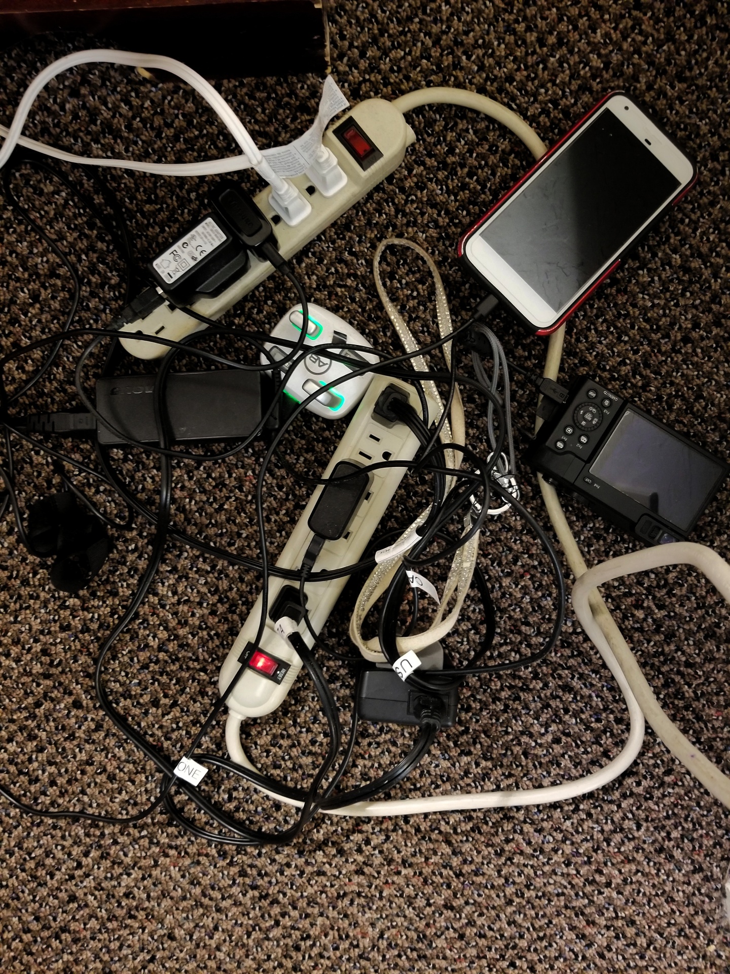 charging electronics plugged in flat lay free photo