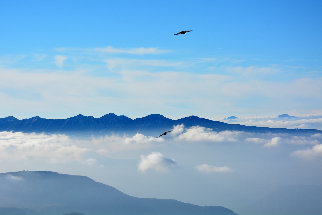 fly clouds mountains free photo