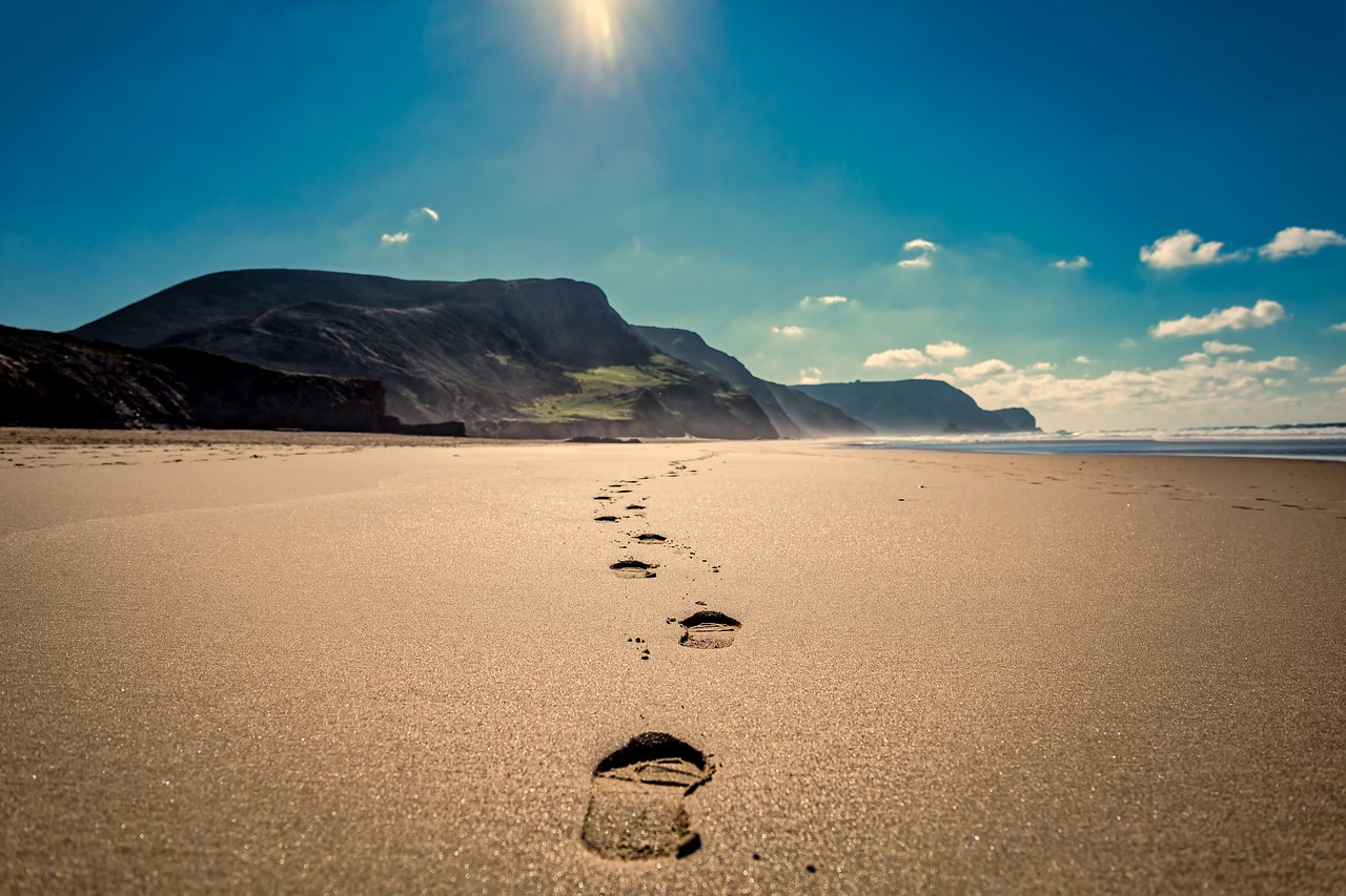 footsteps  beach  sand free photo