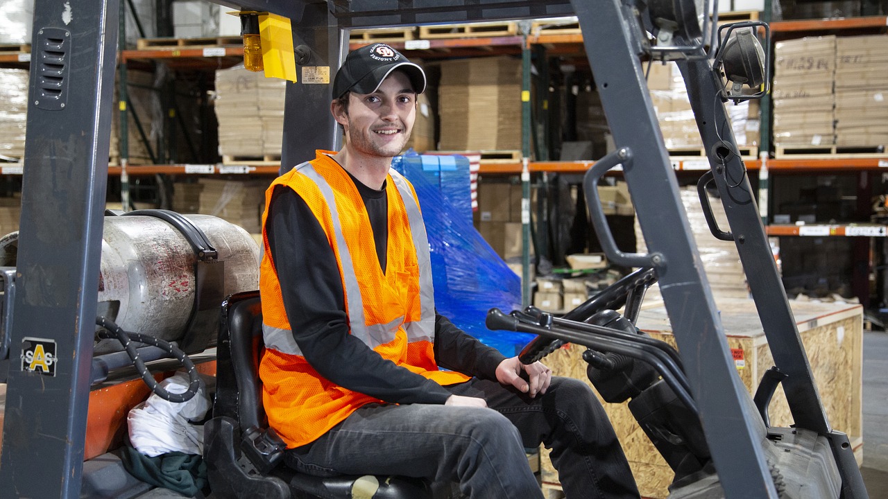 forklift  worker  warehouse free photo