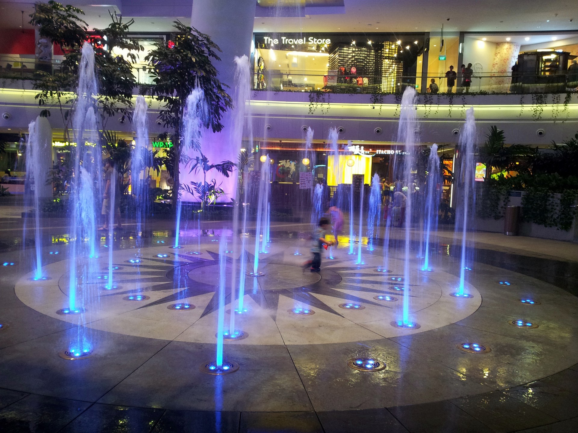 fountain night view kid running around playing cool free photo