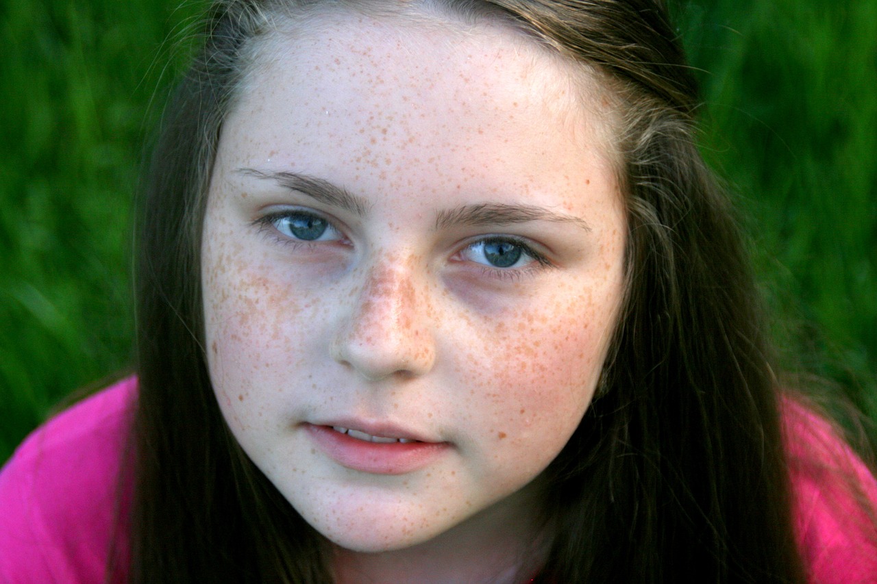 freckle face portrait grass free photo