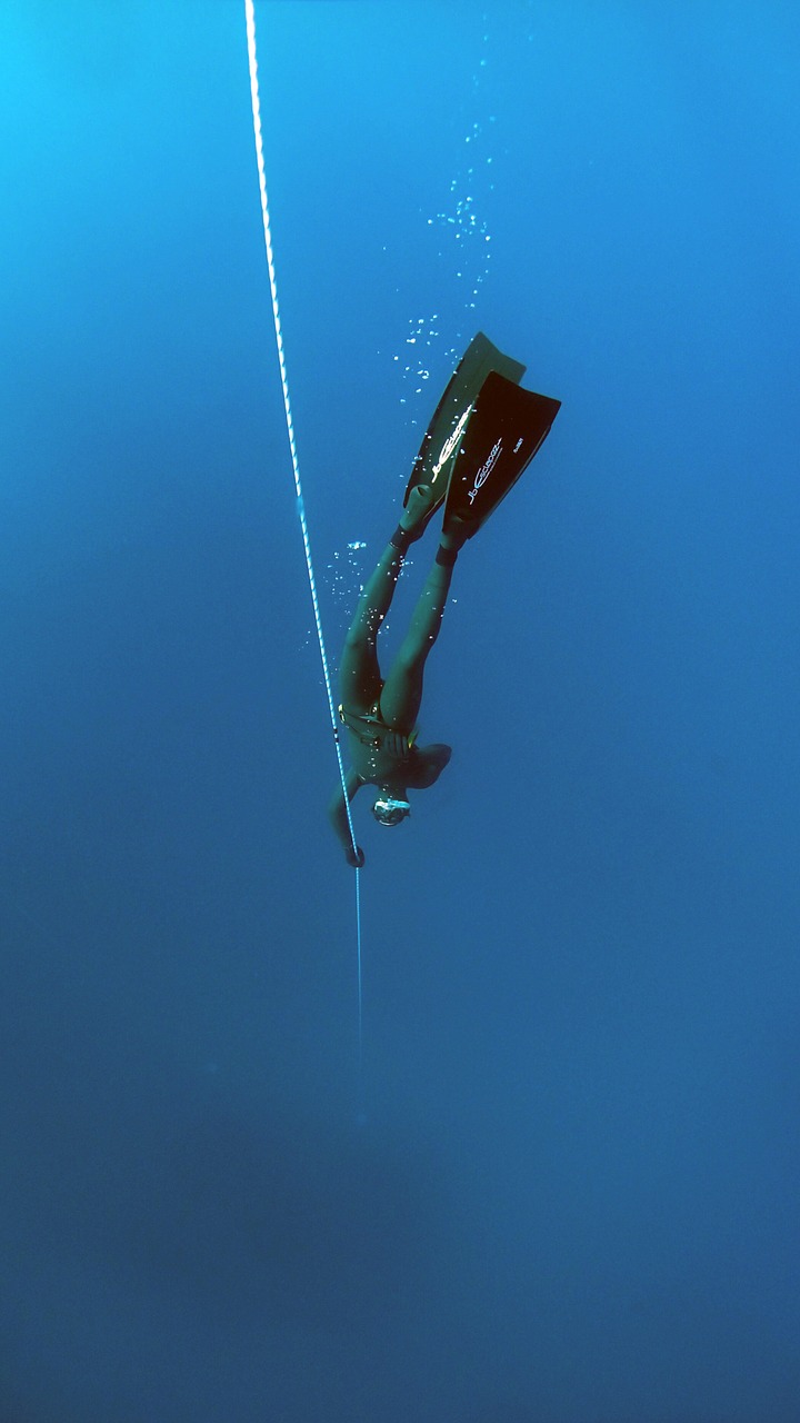 freediving deep underwater free photo