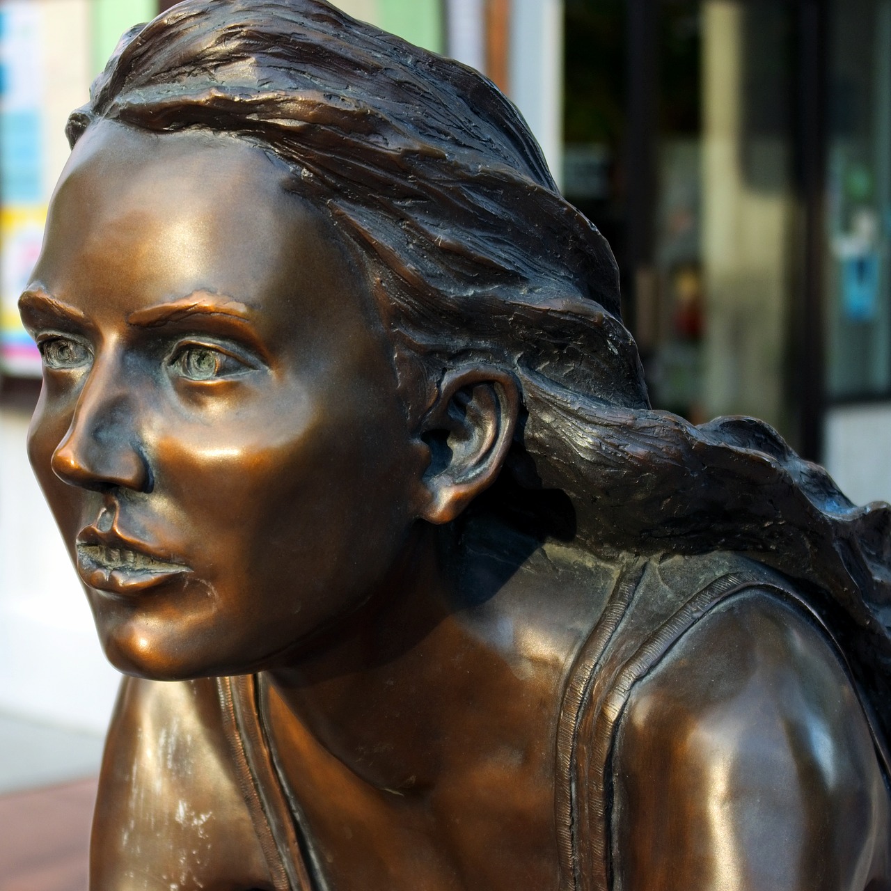 freewheelin bronze sculpture  young  female free photo