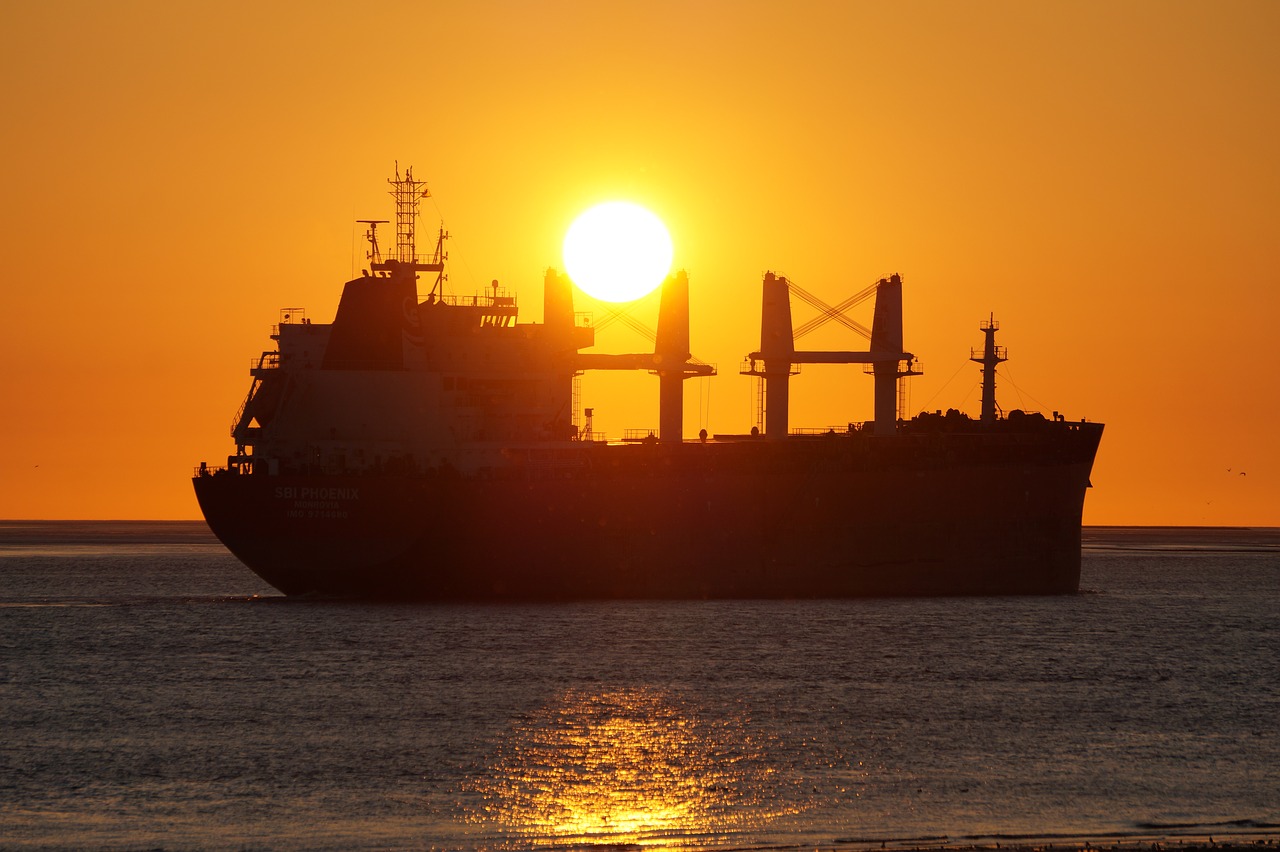 freighter  sunset  water free photo