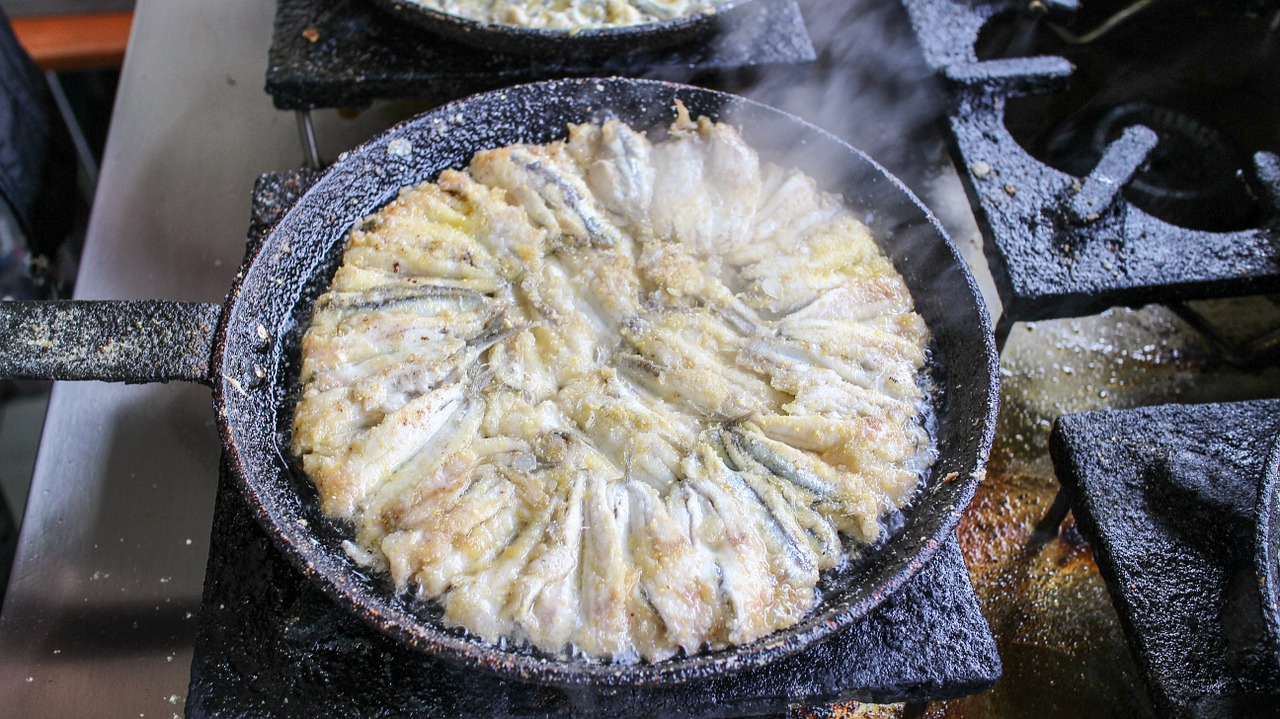 fried anchovy frying pan cooking free photo