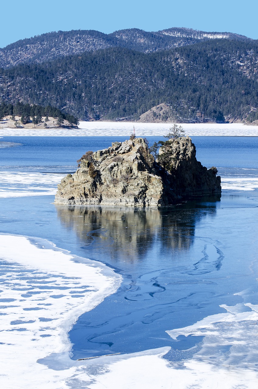 frozen lake rocks mountain lake free photo