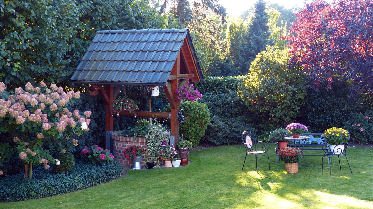 garden fountain flowers free photo