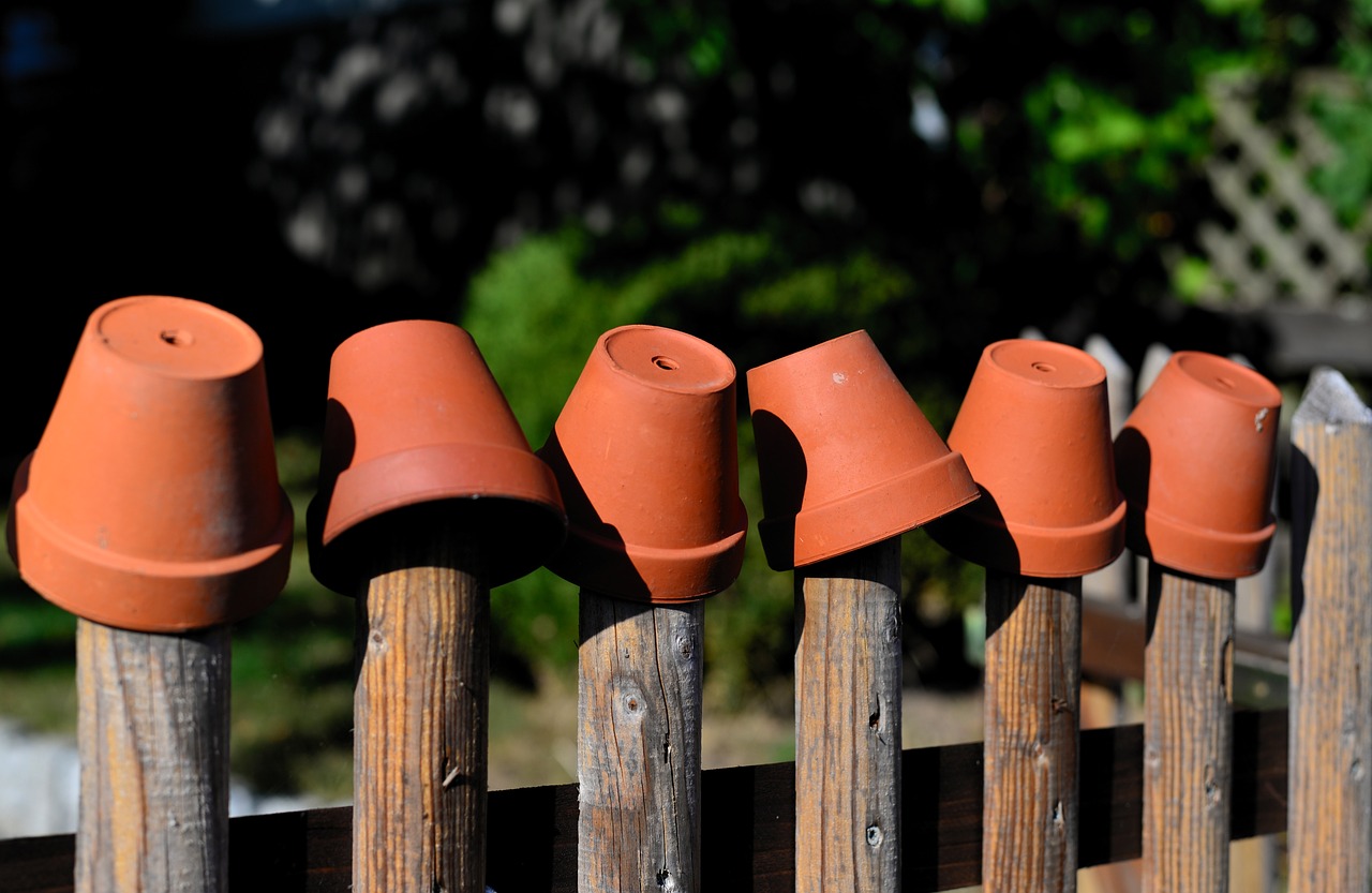 garden fence  flower pots  clay pots free photo