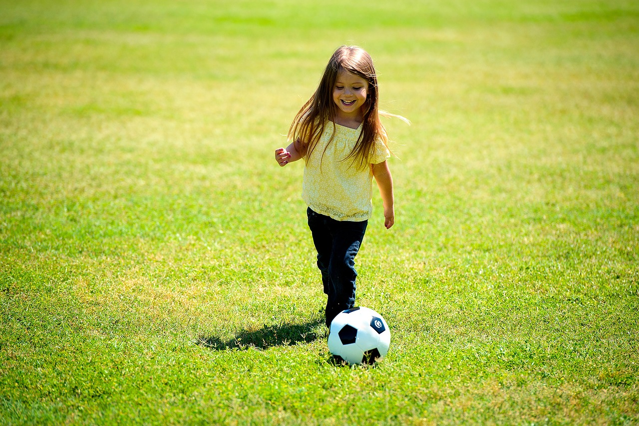 girl playing soccer free photo
