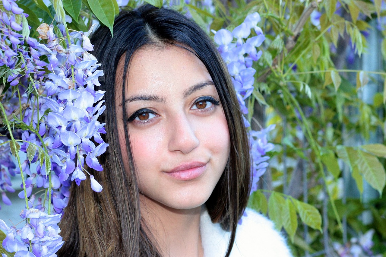 girl brown eyes flowers free photo