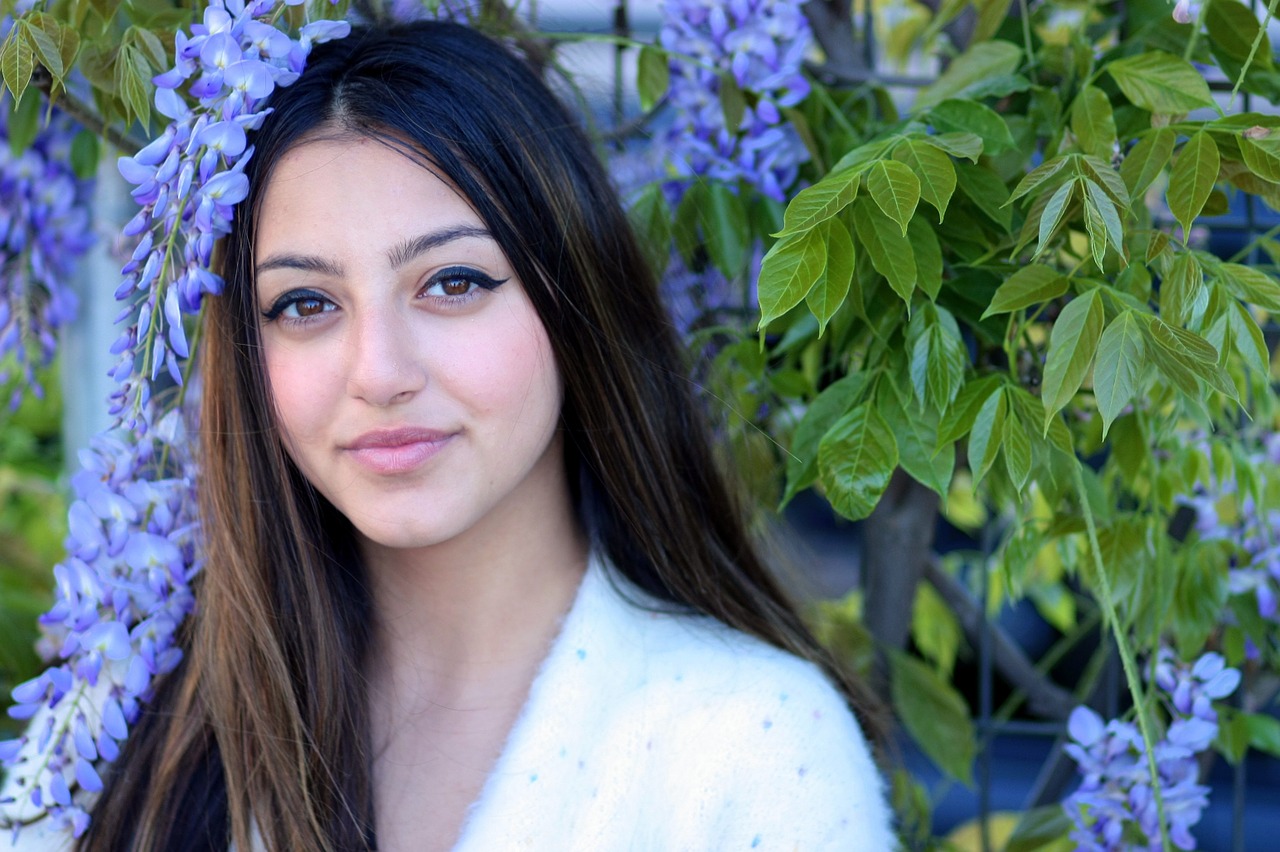 girl brown eyes flowers free photo