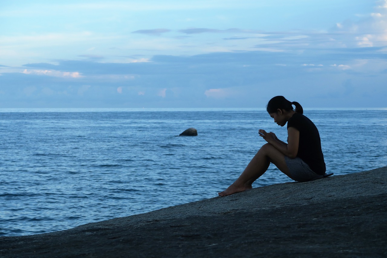 girl rock seaside free photo