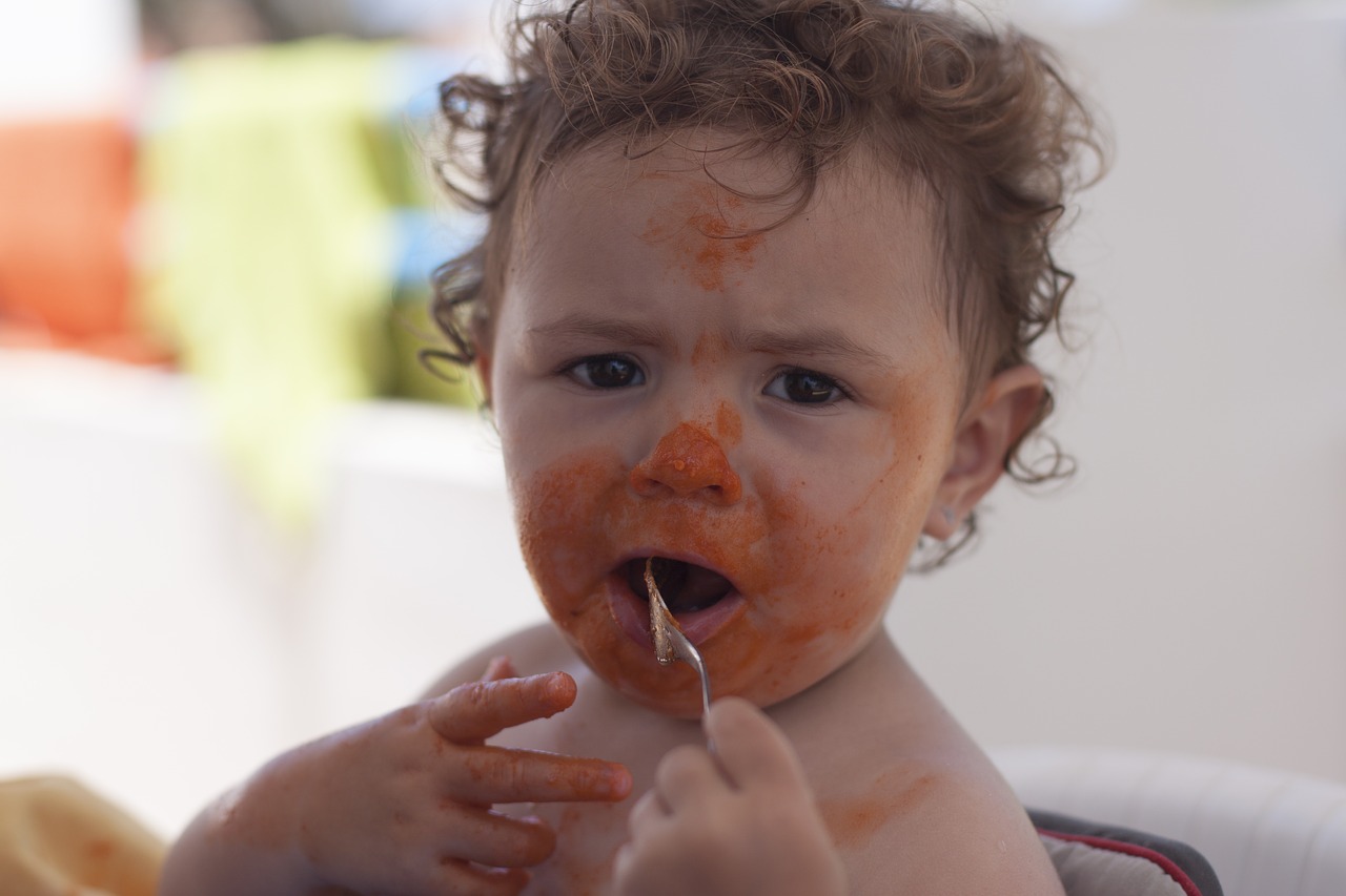 girl eating tomato free photo