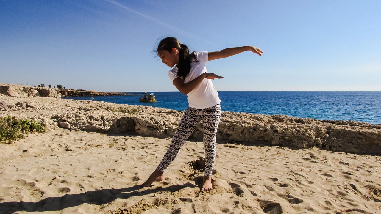 girl dancing beach free photo