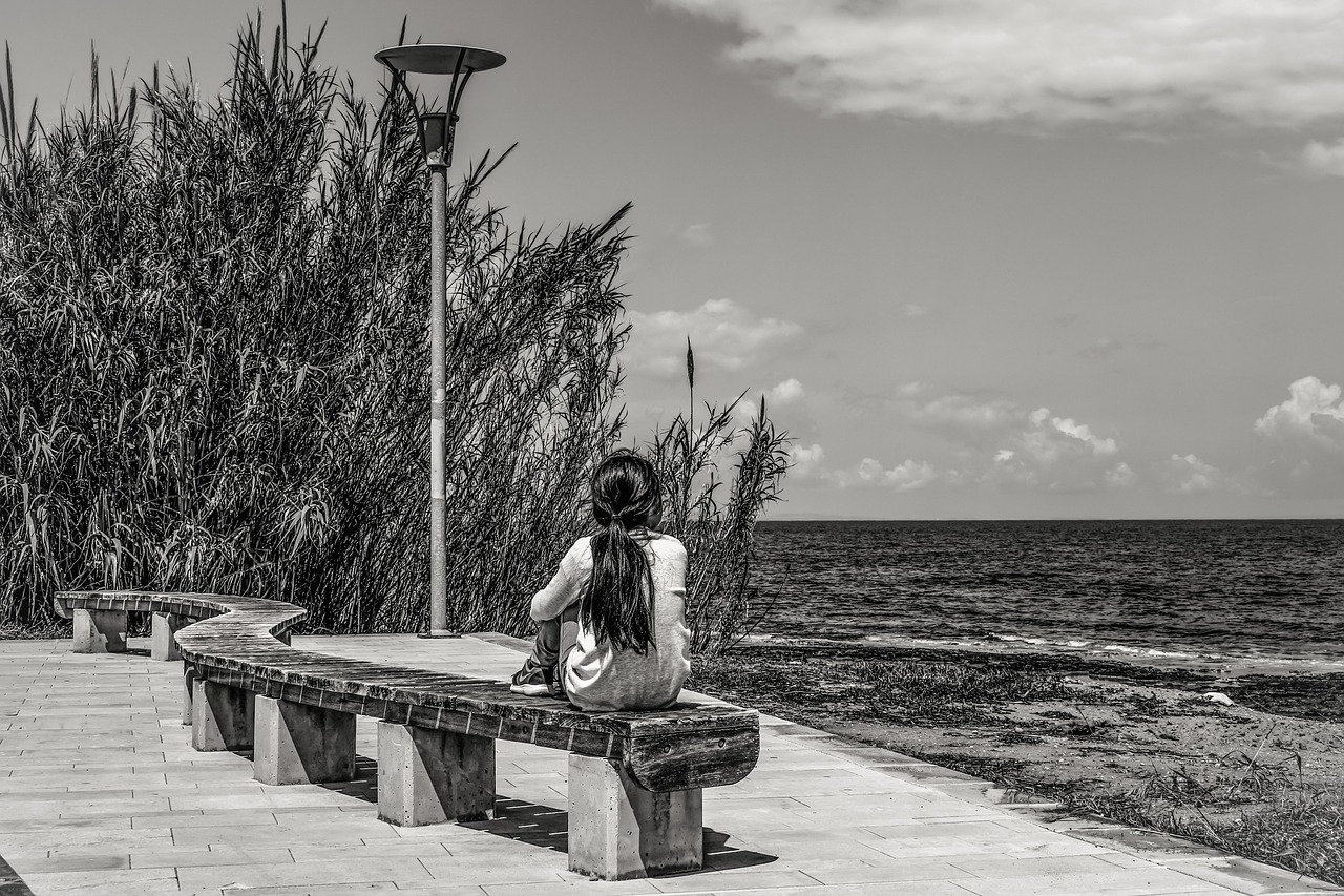 girl thoughtful by the sea free photo