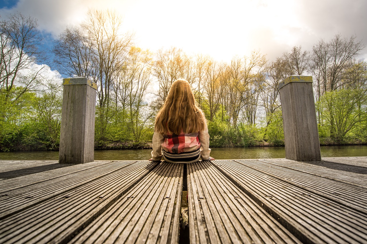 girl sitting dock free photo