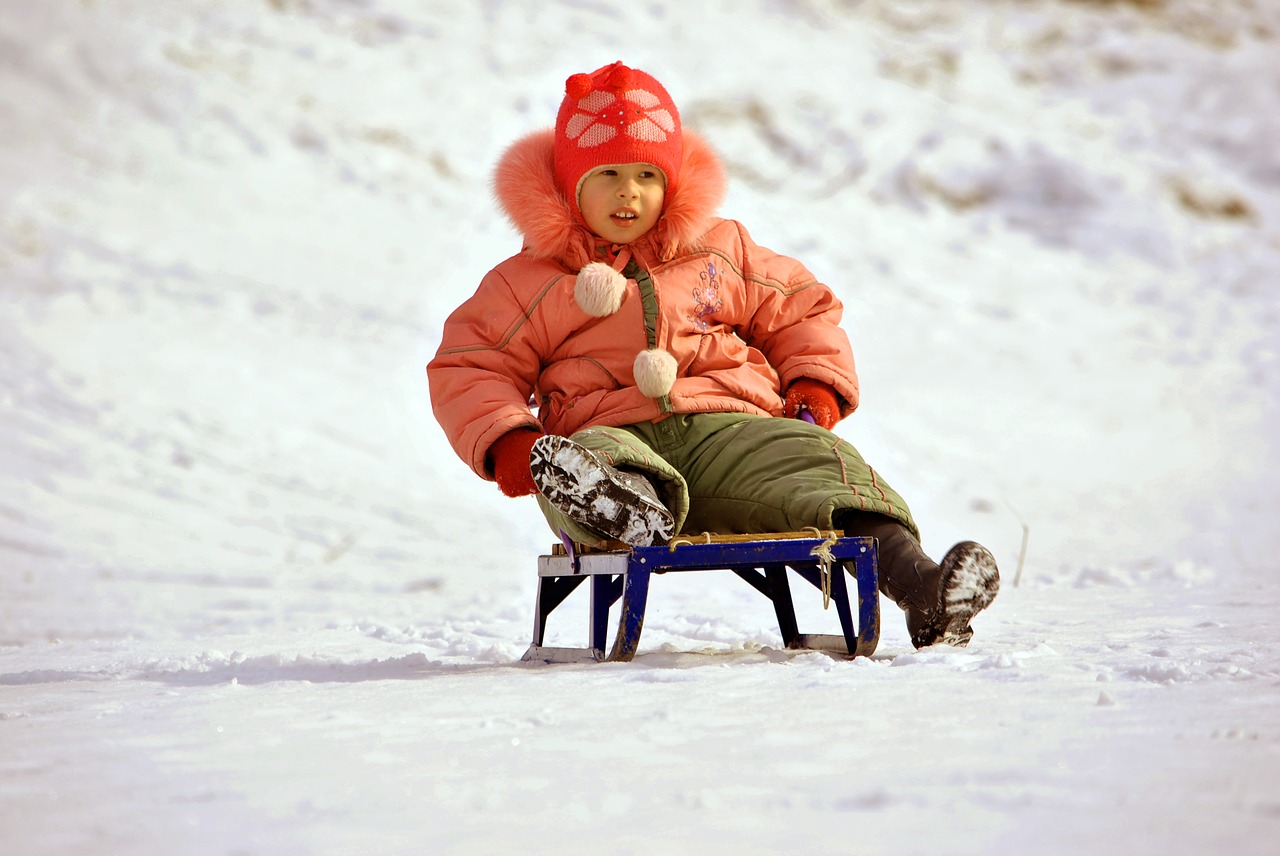 girl riding sled free photo