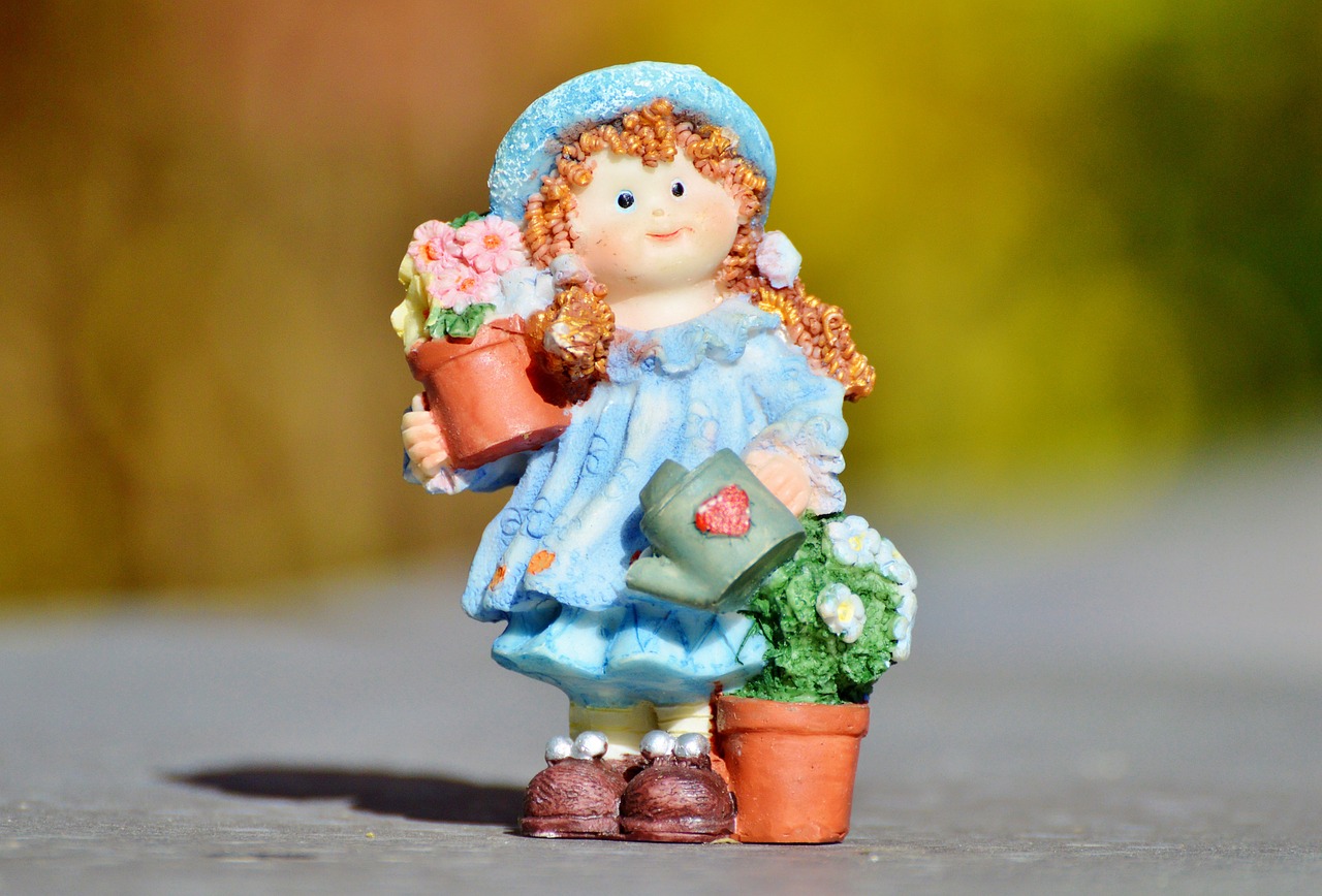 girl doll gardener free photo