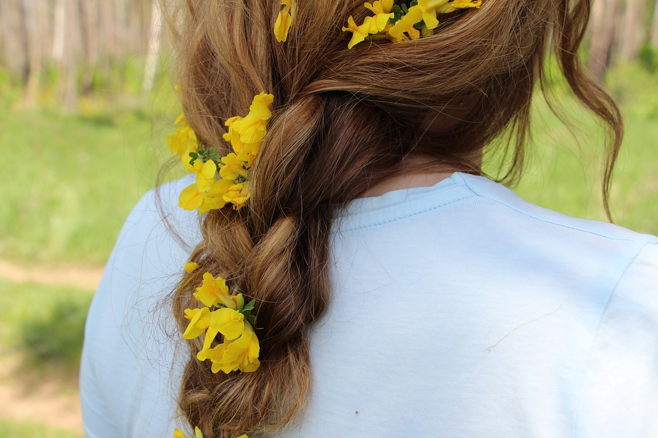 girl pigtail flowers in her hair free photo